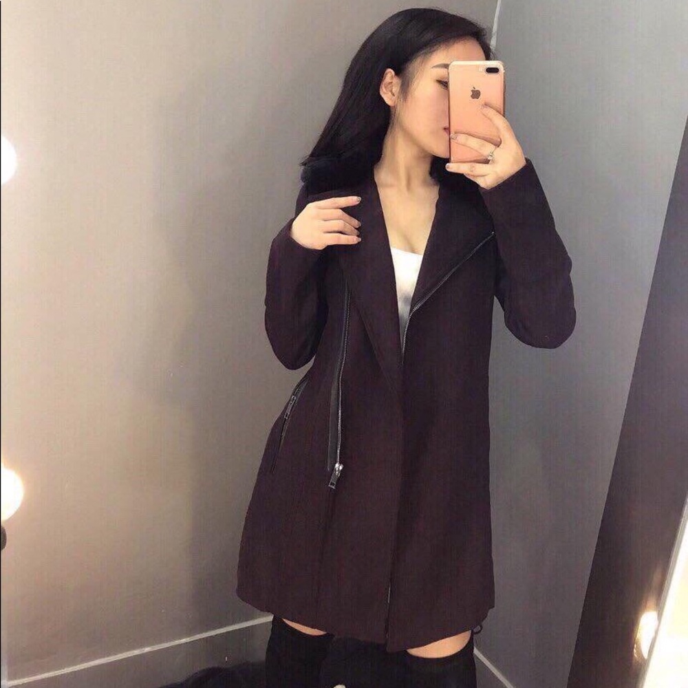 Asymmetrical coat with faux-fur-collar